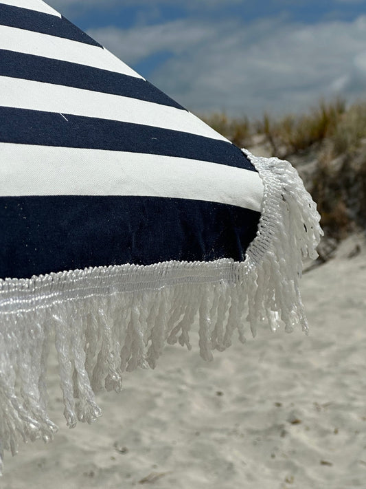 Hollie & Harrie Classic Fringe 210cm canvas beach umbrella with cotton fringe at sandy beach