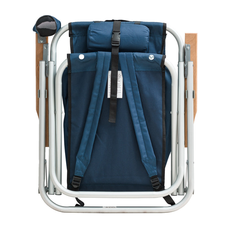 Beachkit Wearever Backpack Chair folded with blue fabric, silver frame, wooden armrests, and backpack straps for portable seating