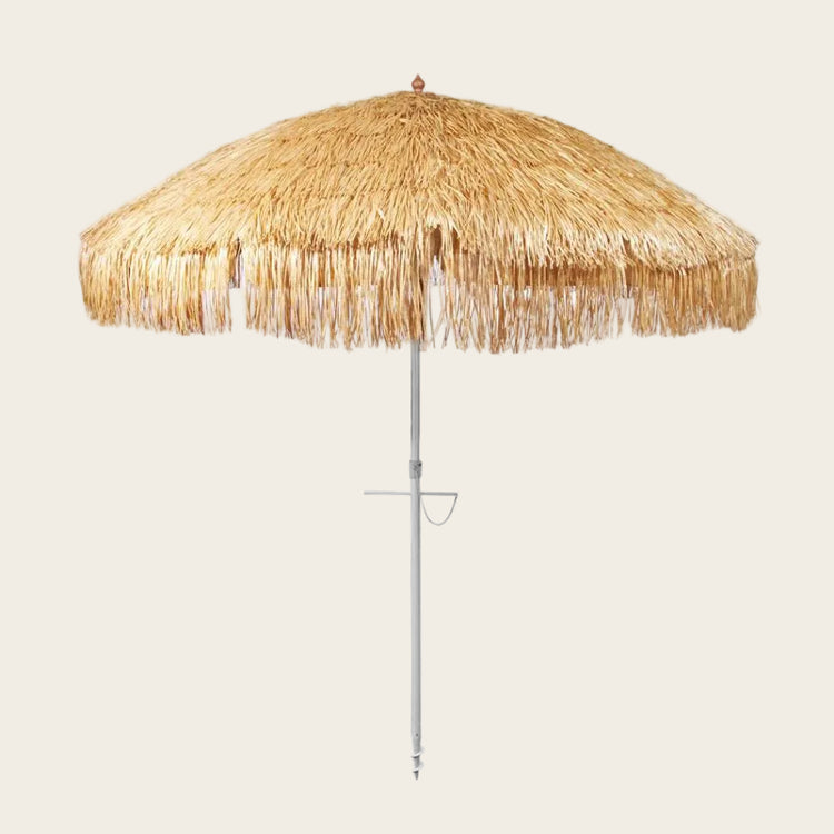 Hula 210cm Beach Umbrella with raffia thatch canopy, anodised pole, quick-twist sand anchor, 3-way tilt, UPF 50+ UV protection, and wind-vented top for beach shade and resort style.