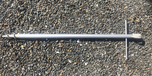 Lower replacement pole for 210cm umbrellas lying on gravel surface