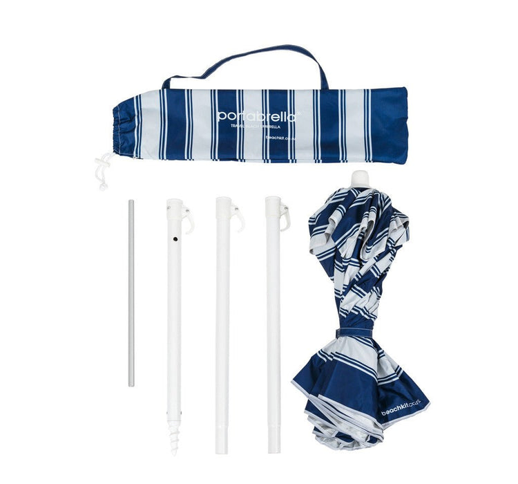 Compact beach umbrella Portabella with nautical stripe pattern and carry bag, disassembled for easy transport