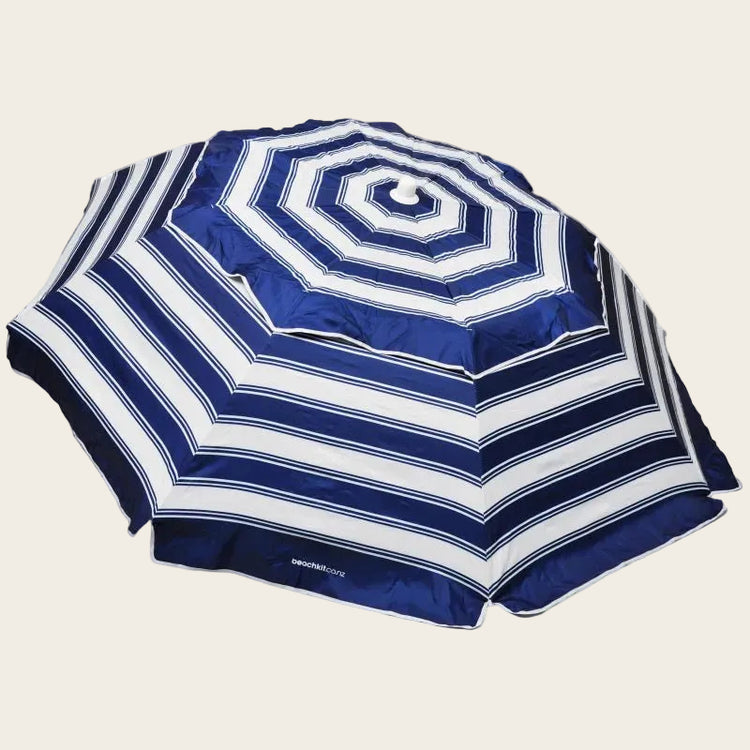 Compact blue and white nautical stripe beach umbrella with self-anchoring auger, lightweight and portable design
