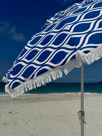 Hollie & Harrie Classic Fringe 210cm Canvas Beach Umbrella - Moroccan The Fringe 210cm Beach Umbrella is a classic beach lovers staple. The thick &amp; luxurious 100% cotton canopy with a retro fringe makes for an Instagram worthy picnBeachkit