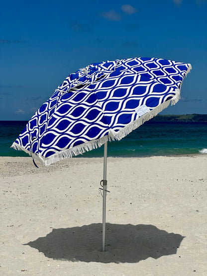 Hollie & Harrie Classic Fringe 210cm Canvas Beach Umbrella - Moroccan The Fringe 210cm Beach Umbrella is a classic beach lovers staple. The thick &amp; luxurious 100% cotton canopy with a retro fringe makes for an Instagram worthy picnBeachkit