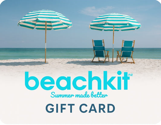 Beachkit gift card with two striped umbrellas and chairs on a sandy beach.