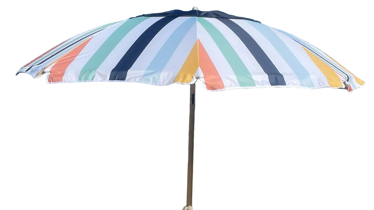 Colorful striped beach umbrella with two chairs on a sandy beach.